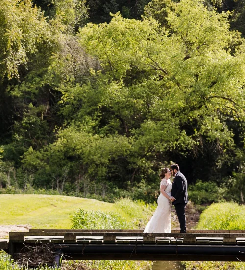 Couple on bridge photo op - Redwood Canyon by Wedgewood Weddings